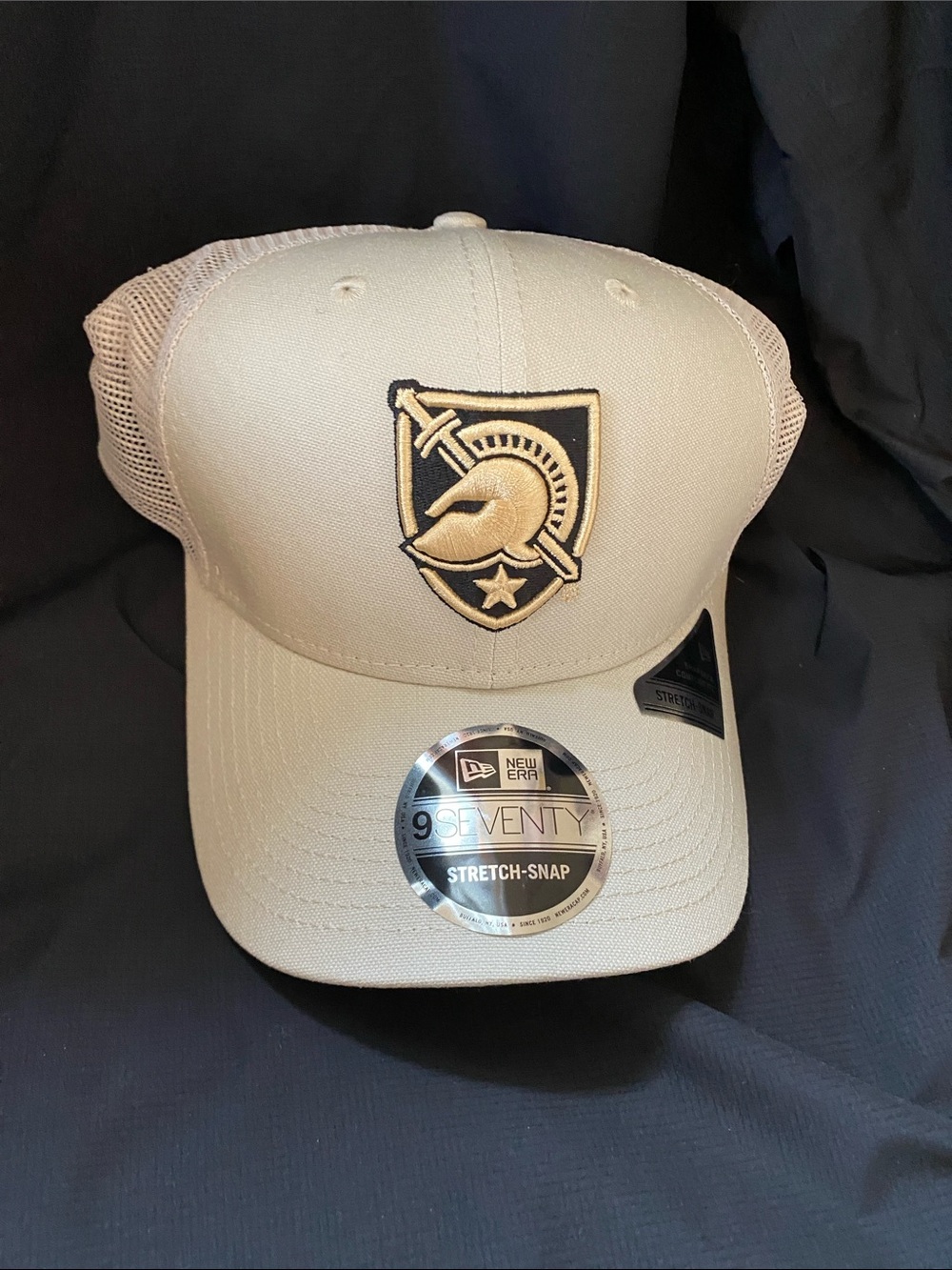 New Era Tan Trucker Cap with Black & Gold Crest Patch